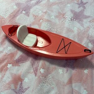 Red Toy Kayak with White Seat